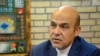 Iran -- Alireza Akbari, former employee of the Ministry of Defense of Iran who has been accused of espionage