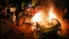 U.S. -- America Protests Washington -- Demonstrators start a fire as they protest the death of George Floyd, Sunday, May 31, 2020, near the White House in Washington. Floyd died after being restrained by Minneapolis police officers